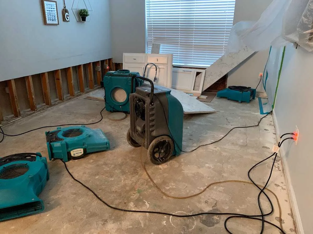 Dehumidifier in flood-cut room for Water Damage Restoration in Brighton